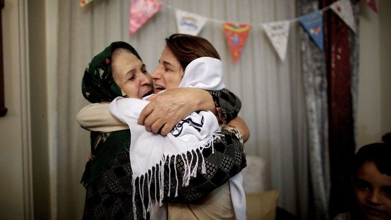 Iranian lawyer Nasrin Sotoudeh (R) hugs her mother-in-law at her house in Tehran following being freed after three years in prison