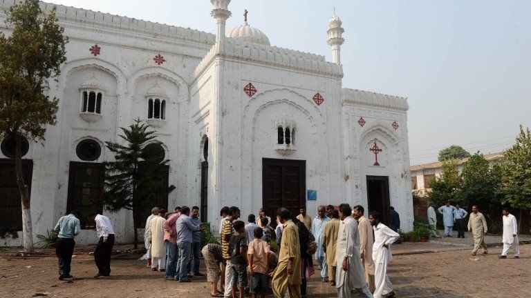 Pakistani Christian gather at All Saints church in Peshawar on September 23, 2013, the day after a suicide bomb attack