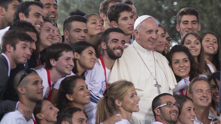 Pope Francis poses for a photo after a meeting with youths in downtown Cagliari, Italy, 22 September 2013