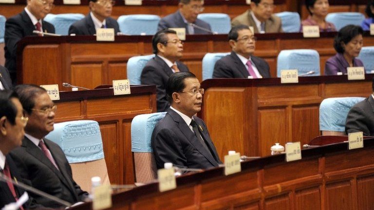 Cambodian Prime Minister Hun Sen (front C) sits during the National Assembly meeting in Phnom Penh on 24 September 2013