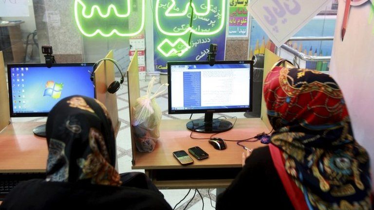 Iranian women surf the Internet at a cafe in Tehran