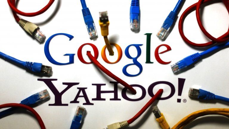 An illustration picture shows the logos of Google and Yahoo connected with LAN cables in a Berlin office on 31 October 2013