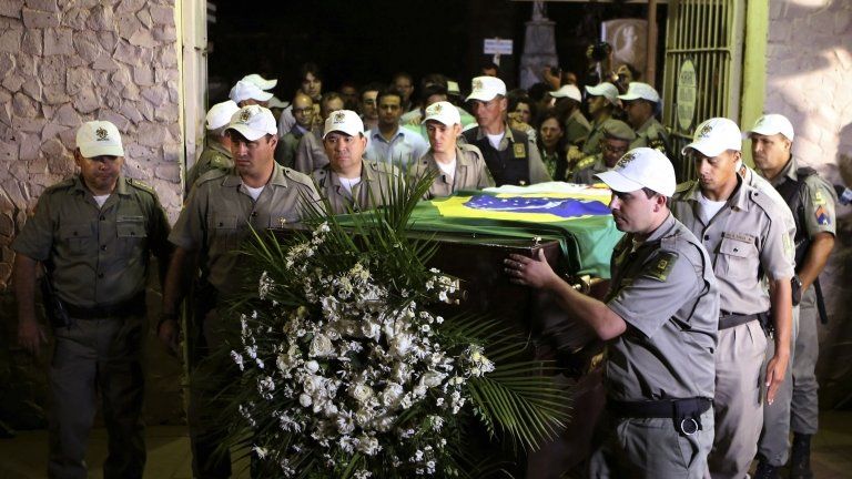 The exhumed remains of Brazils former president Joao Goulart are carried from the Jardim da Paz cemetery in Sao Borja on 14 November, 2013