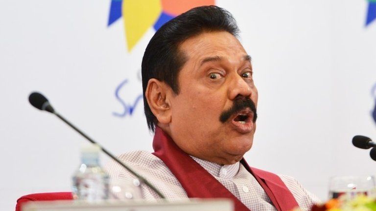 Sri Lanka President Mahinda Rajapaksa answers a question during a press conference