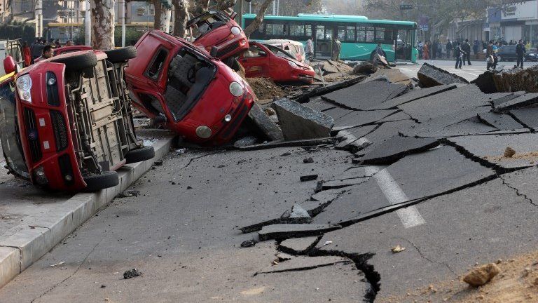 A general view of the damage after a oil pipeline exploded in Qingdao, China, on 22 November 2013