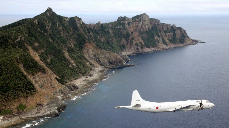 Japanese PC3 surveillance plane flies around the disputed islands in the East China Sea on 13 October 2011