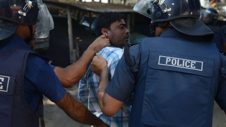 Bangladeshi police detain a BNP supporter following clashes during a blockade organised by Bangladesh Nationalist Party (BNP) activists and its Islamist allies in Aminbazer, in the outskirts Dhaka on November 26, 2013.