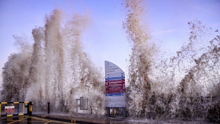 Picture taken at the seafront in Cleethorpes as waves hit (smash against) the seafront during stormy weather