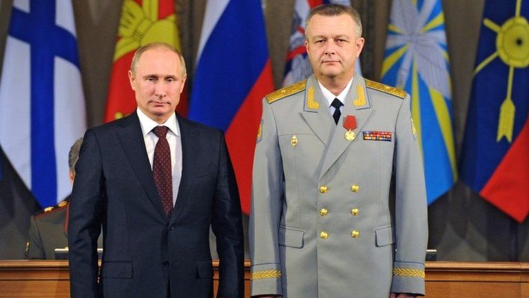 Russian President Vladimir Putin (left) with the Commander of the Russian Military Air and Space Defence Forces, Alexander Golovko, in Moscow, 10 December