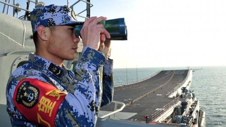 File photo: A Chinese naval soldier on board China's aircraft carrier Liaoning