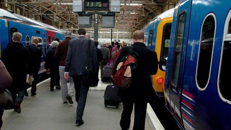 Rail commuters in King's Cross station