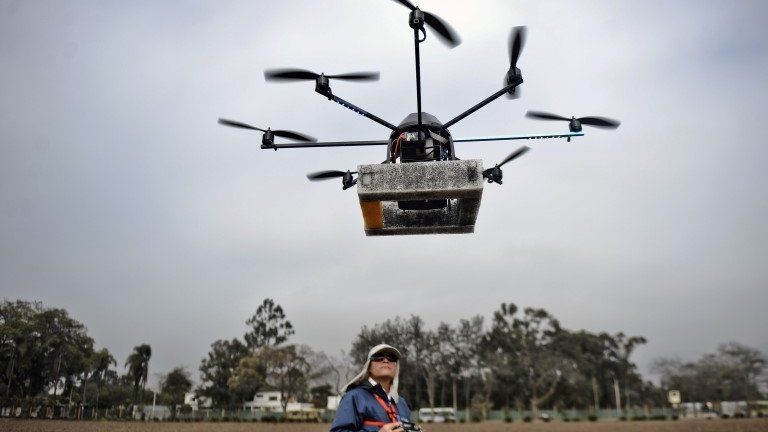 A man controls a drone in Lima, Peru, on 10 July 2013