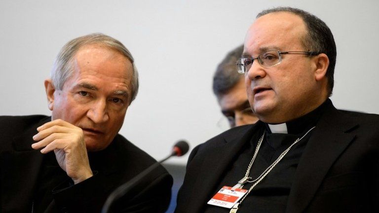 The Vatican's UN Ambassador, Monsignor Silvano Tomasi (L), speaks to former Vatican Chief Prosecutor of Clerical Sexual Abuse Charles Scicluna at the hearing in Geneva, 16 January