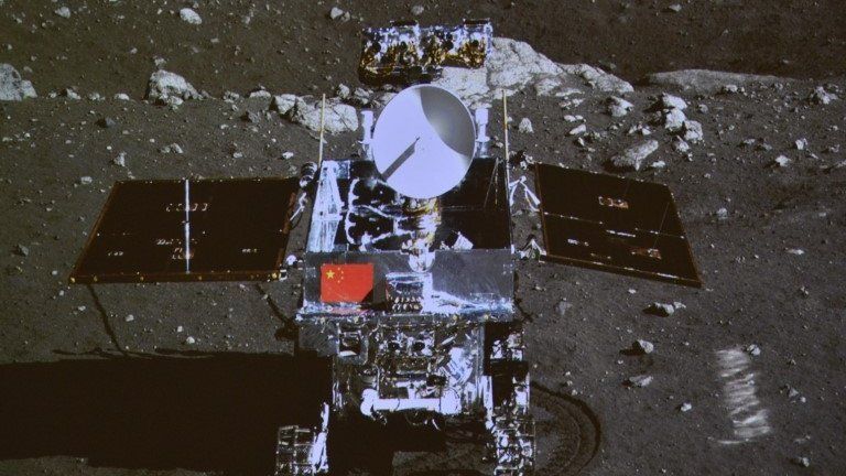 A photograph of the giant screen at the Beijing Aerospace Control Center shows a photo of the Yutu, or "Jade Rabbit" lunar rover in Beijing, 15 December 2013