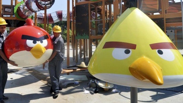 Workers install a recreation facility at an Angry Birds theme park in Haining, Zhejiang province 10 July 2013