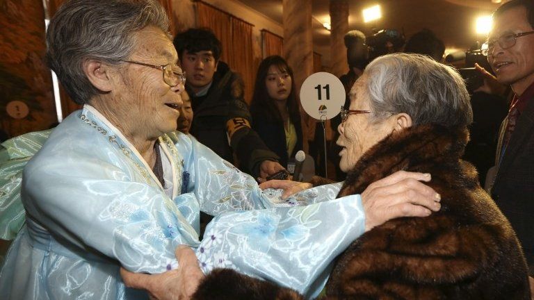 North Korean Kim Seok-ryeo (left), 80, looks at her South Korean sister Kim Sung-yun, 96, during their family reunion at the Mount Kumgang resort in North Korea, 20 February 2014