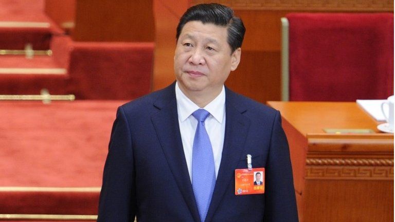 Chinese President Xi Jinping arrives at the opening session of the 12th National People"s Congress (NPC) in the Great Hall of the People in Beijing on March 5, 2014.