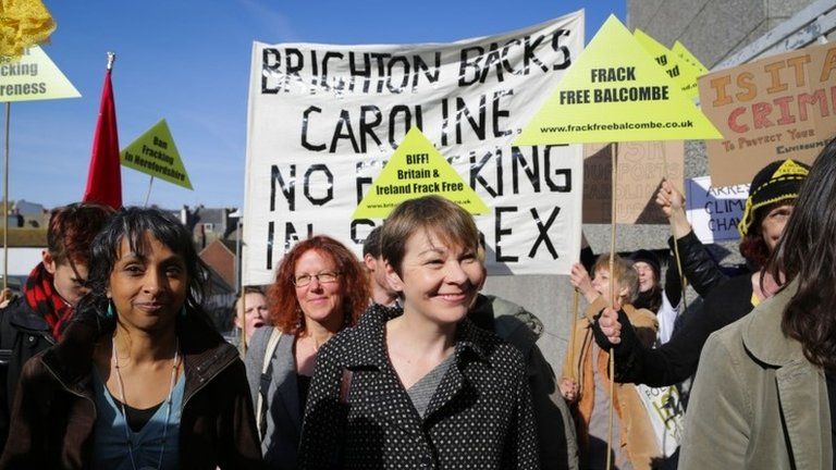 Caroline Lucas with fracking protesters outside court