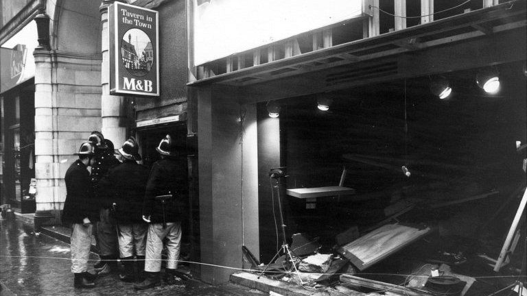 Firemen outside the bombed Tavern in the Town in Birmingham in 1974