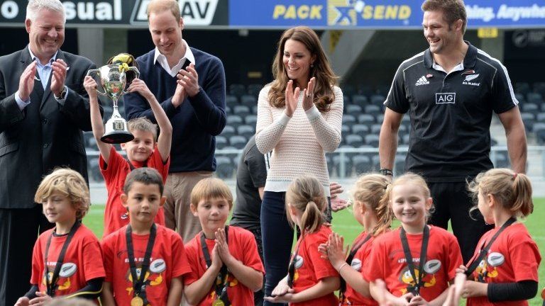 Prince William, Duke of Cambridge, Catherine, Duchess of Cambridge and Richie McCaw applaud Rippa Rugby winners as they lift the trophy in the Forstyth Barr Stadium on day 7 of a Royal Tour to New Zealand