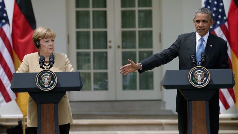 German Chancellor Angela Merkel (L) and US President Barack Obama hold a joint news conference in the Rose Garden at the White House 2 May 2014