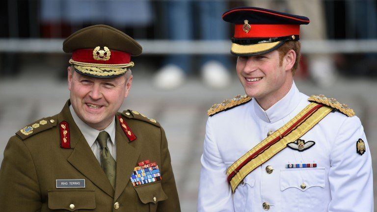 Prince Harry (right) with Chief of General Staff of the Estonian Defence Forces, Major General Riho Terras, in Freedom Square, Tallinn