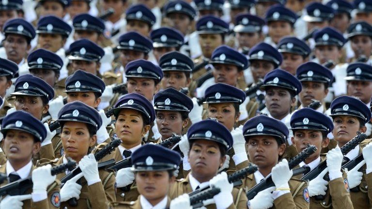 Sri Lankan policewomen march during a Victory Day parade in the southern town of Matara, 18 May 2014