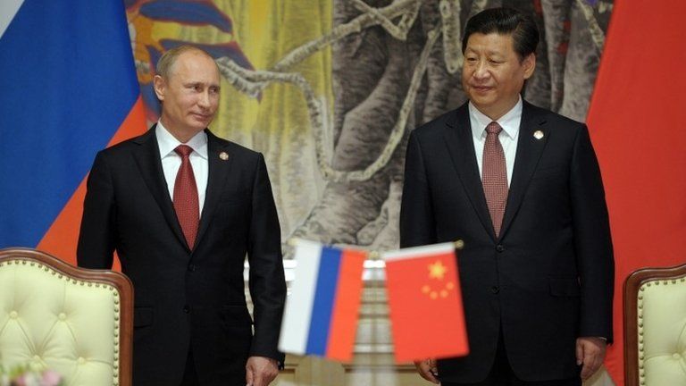 Russian President Vladimir Putin (left) with Chinese President Xi Jinping in Shanghai, China, 21 May