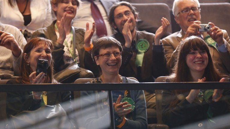 Green Party supporters applaud their elected MEP Jean Lambert as the election result is announced at City Hall in London