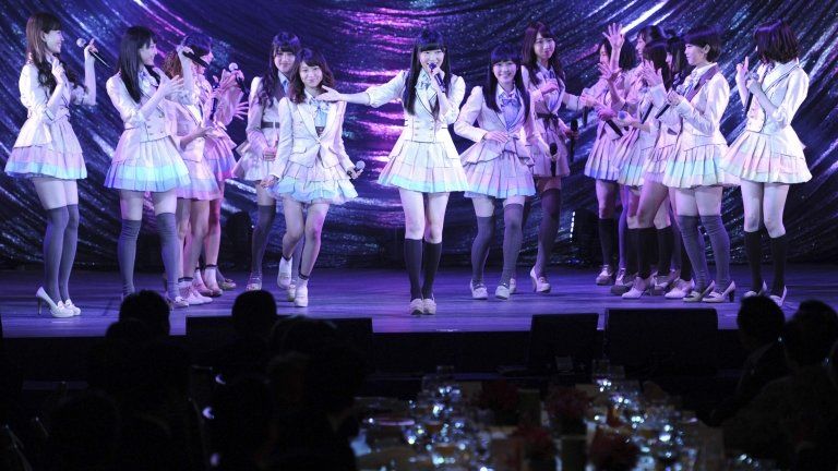Japanese pop group AKB48 performs on the stage during a gala dinner of the ASEAN-Japan Commemorative Summit meeting in Tokyo on 14 December 2013