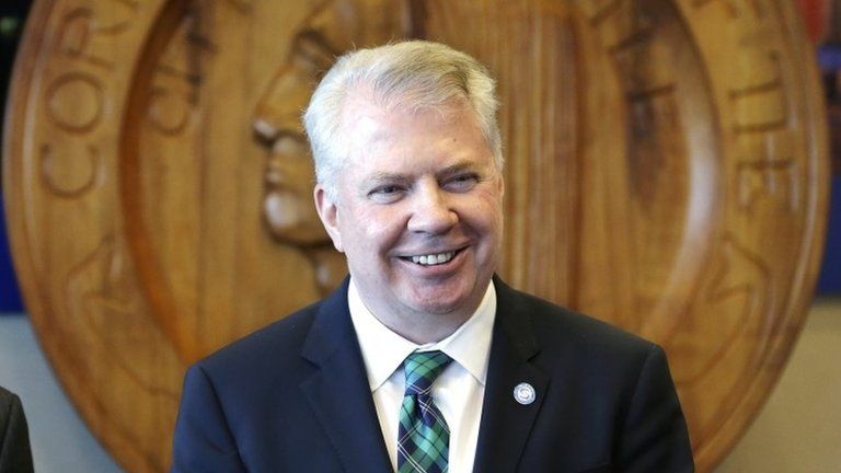 Seattle Mayor Ed Murray smiles as he addresses a news conference on a proposal to increase the minimum wage in the city 24 April 2014
