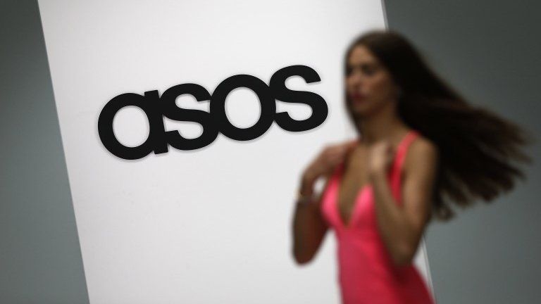 A model walks on an in-house catwalk at the ASOS headquarters