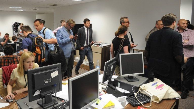 Journalists gather at the offices of Wprost in Warsaw, 18 June
