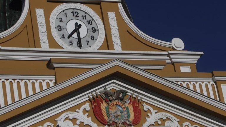 The hands on the clock of the legislative palace are moving left on the legislative building in La Paz, Bolivia, Tuesday on 24 June, 2014
