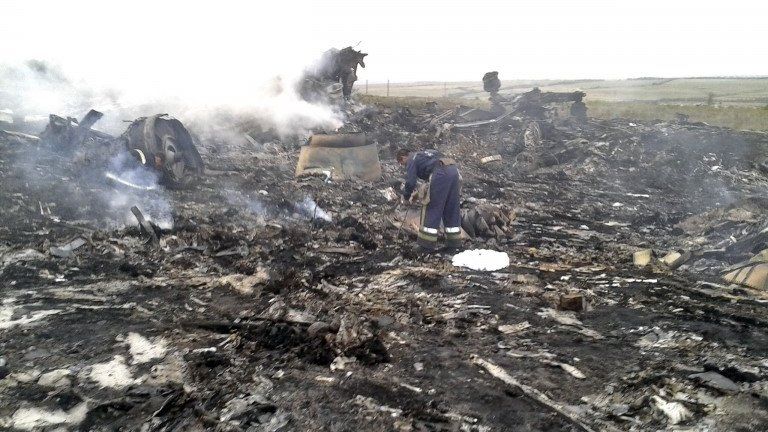 An Emergencies Ministry member works at the site of a Malaysia Airlines Boeing 777 plane crash in the settlement of Grabovo in the Donetsk region, Ukraine, 17 July 2014