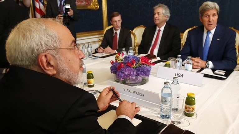 Iran's Foreign Minister Javad Zarif (L) holds a bilateral meeting with U.S. Secretary of State John Kerry