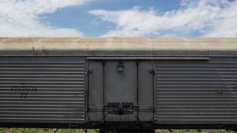 A freight wagon carrying the remains of MH17 victims in Torez station, eastern Ukraine, 20 July