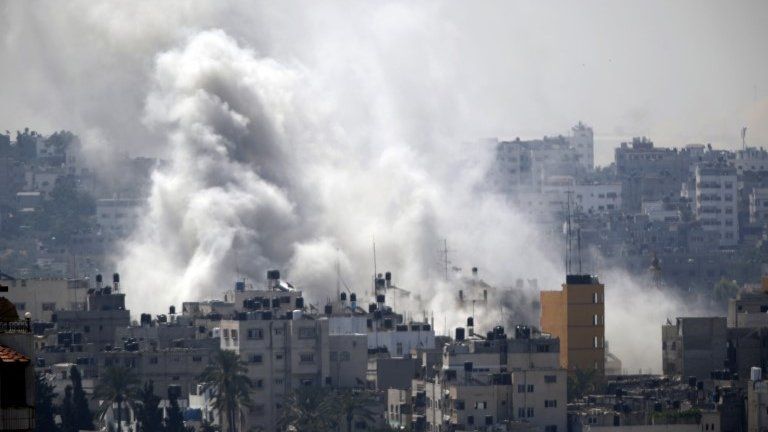 Smoke from an Israeli strike rises over Gaza City, 23 July 2014
