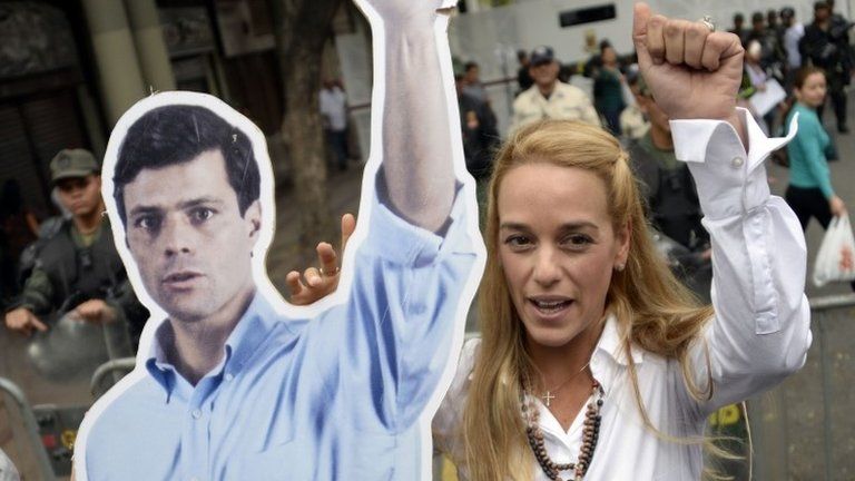Lilian Tintori holds a poster of her husband, Leopoldo Lopez