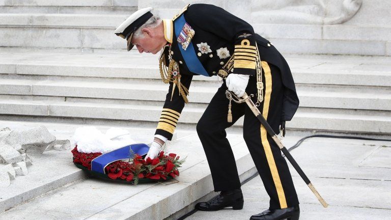Prince Charles, Prince of Wales, known as the Duke of Rothesay in Scotland, lays a wreath at the cenotaph in Glasgow