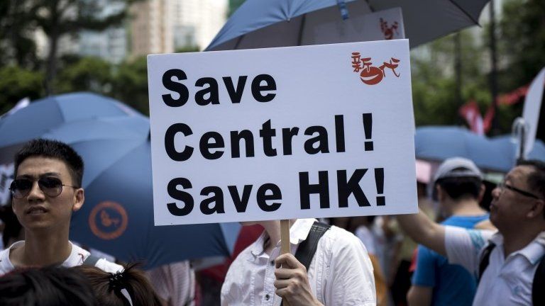 People take part in a pro-government rally in Hong Kong on August 17, 2014.
