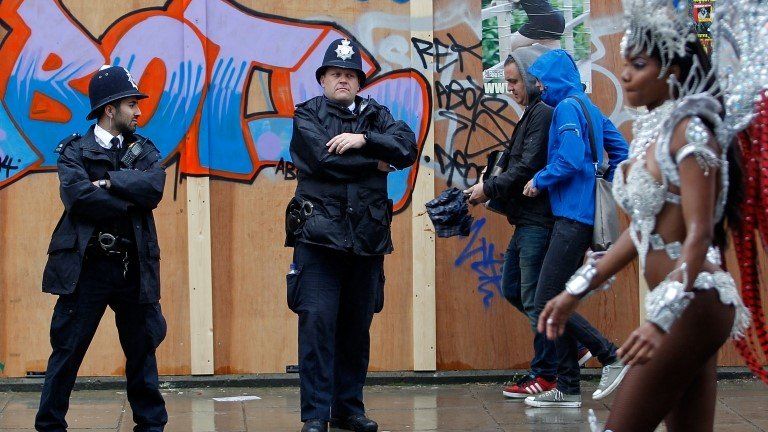 Police officers and revellers at Notting Hill Carnival