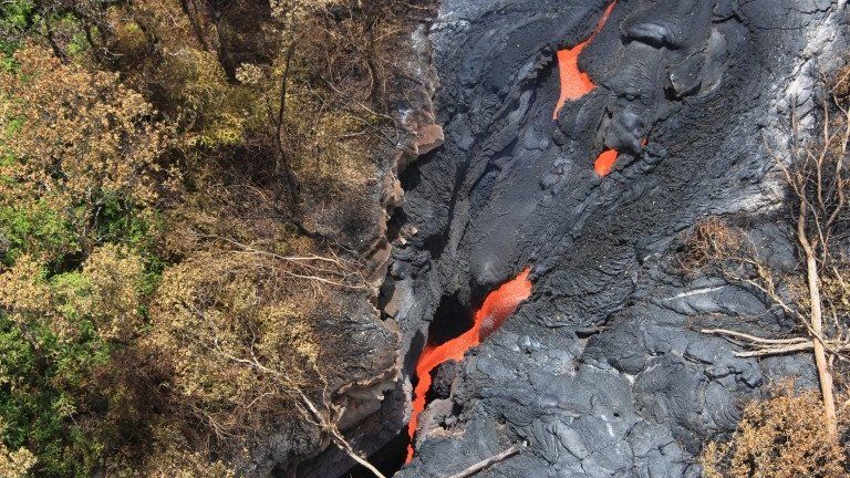 Fluid lava streams from the June 27 lava flow from the Kilauea volcano in Pahoa, Hawaii 1 September 2014