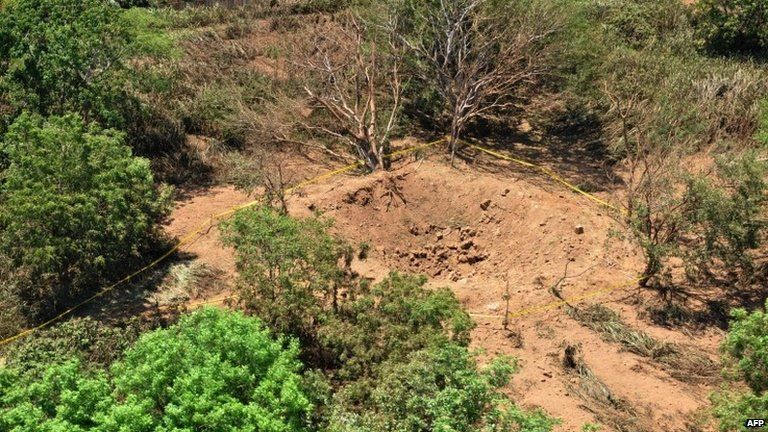 Photo showing the impact crater made by a small meteorite in a wooded area near Managua's international airport.