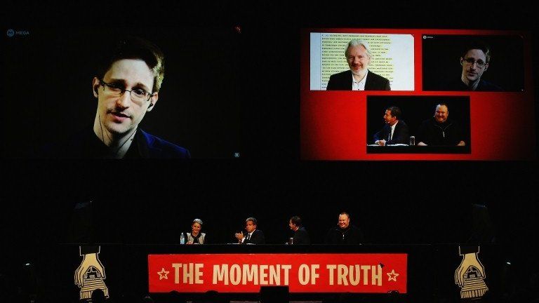 Edward Snowden, Julian Assange, Internet Party leader Laila Harre, Robert Amsterdam, Glenn Greenwald and Kim Dotcom discuss the revelations about New Zealand"s mass surveillance at Auckland Town Hall on September 15, 2014 in Auckland, New Zealand.