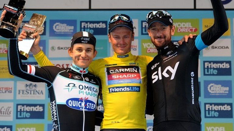 Dylan Van Baarle of Garmin-Sharp (centre) poses with second-placed Micha Kwiatkowskii of Omega Pharma-Quickstep (left) and third- placed Sir Bradley Wiggins of Team Sky (right)