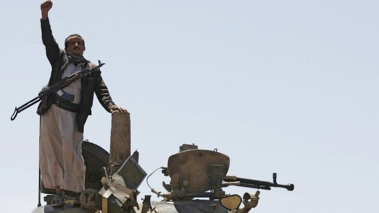 A Houthi rebel on a Yemeni government tank the Shia group took over, in Sanaa, Yemen, on 22 September 2014.