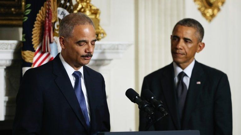 Attorney General Eric H. Holder Jr. announces his resignation, as US President Barack Obama looks on, 25 September 2014