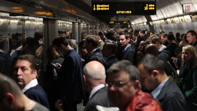 Commuters wait for the Jubilee line at Waterloo underground station
