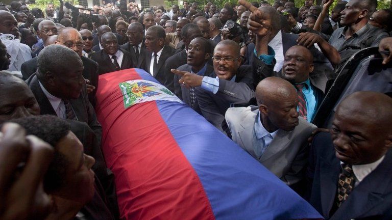 JC Duvalier's coffin draped with the Haitian flag